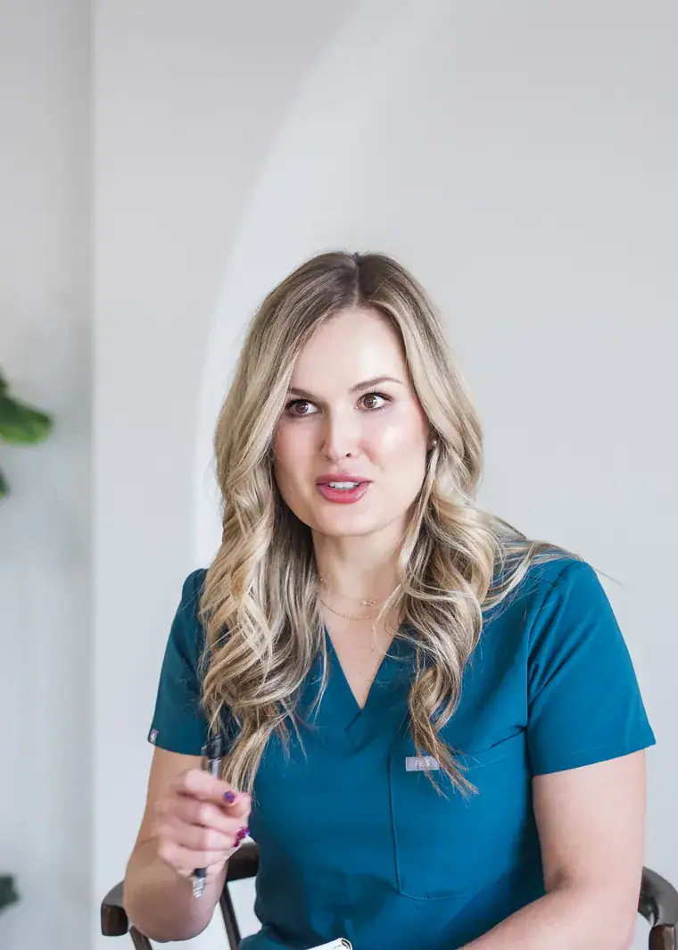 Tami, RN, in conversation with a patient at the Restorica Wellness clinic in Henderson
